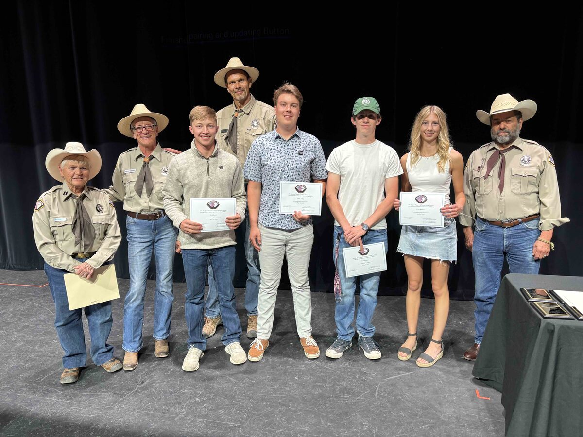Rangers presenting scholarship certificates to graduating seniors
